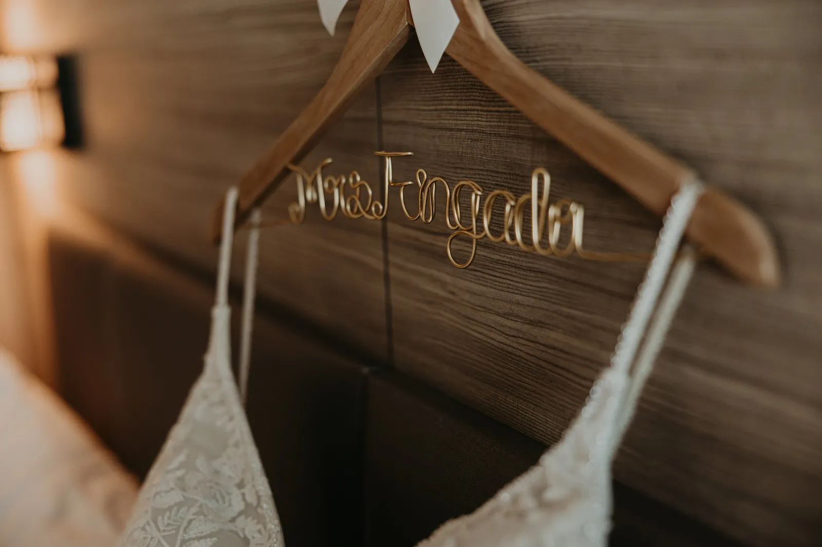 Lace wedding dress on a personalised wooden hanger