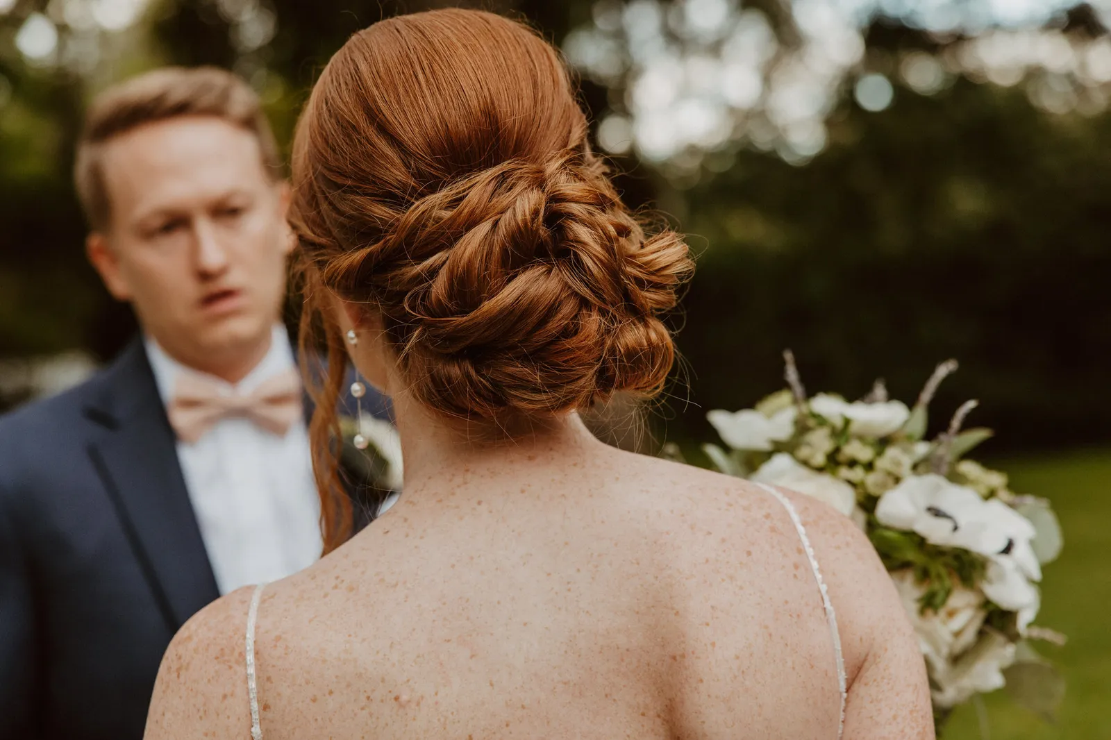 Groom looking at his bride, seen over her shoulder