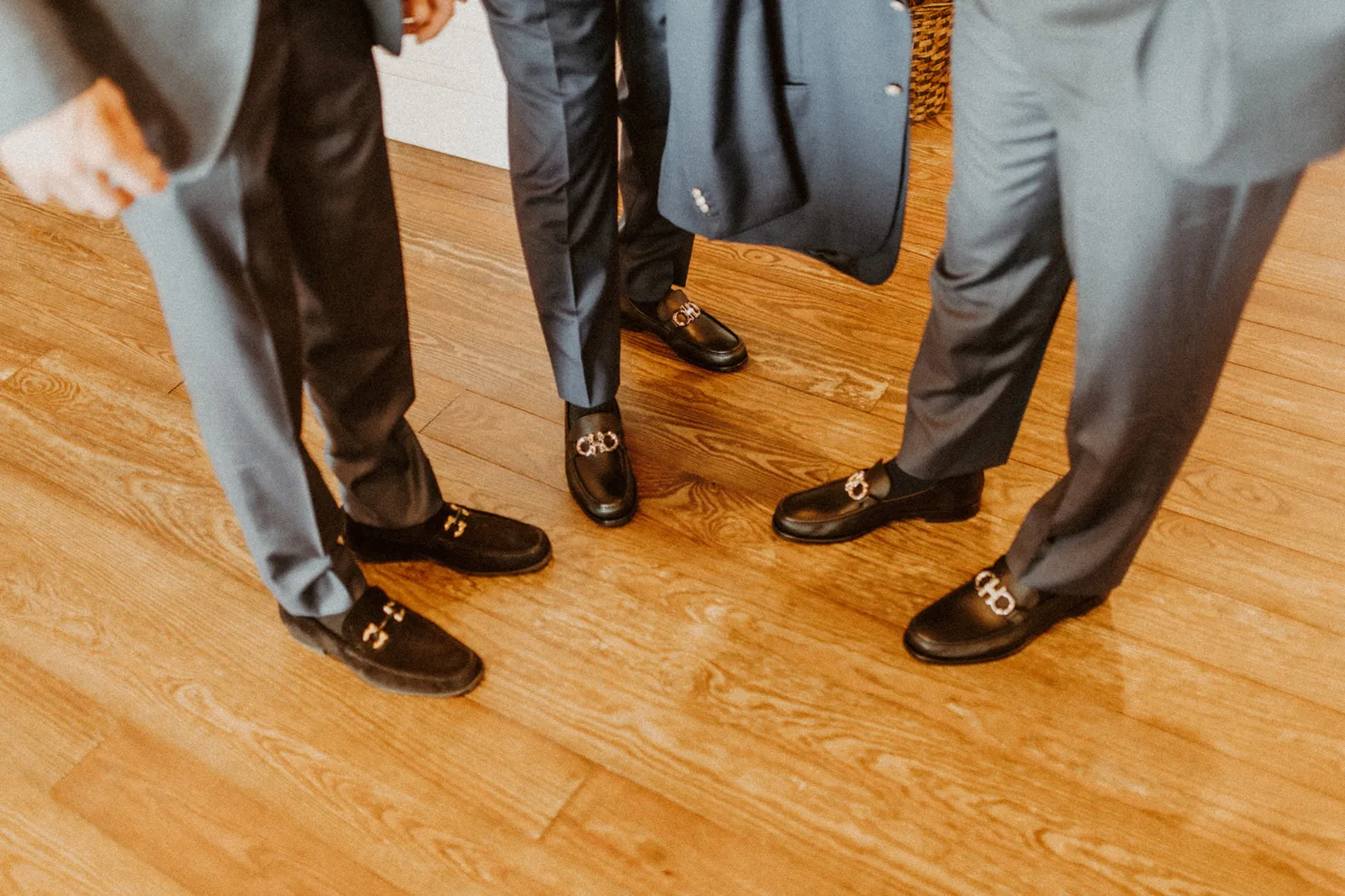 Men's loafers and suit trousers, seen from above