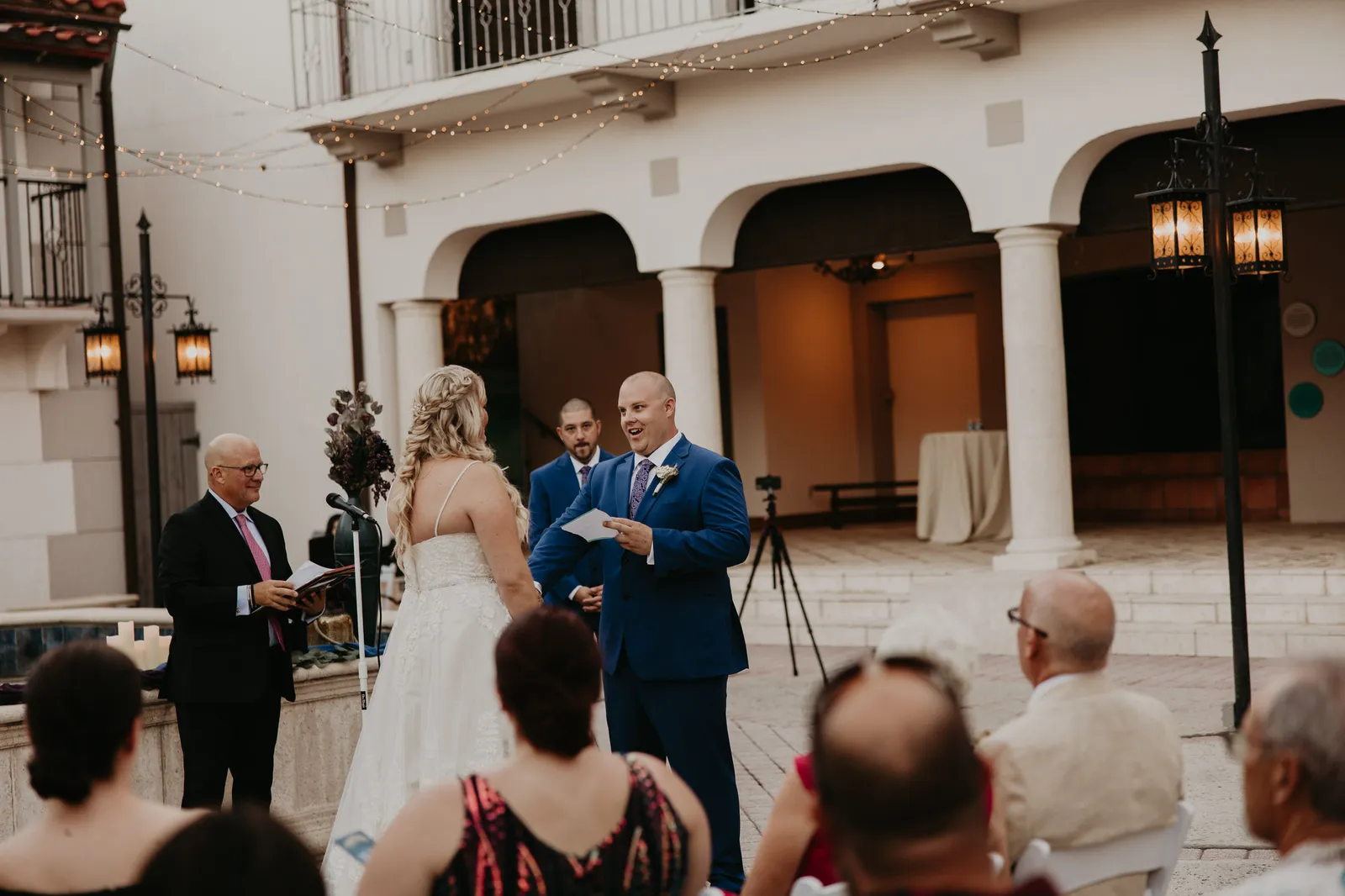 Bride and groom exchanging vows in the museum courtyard