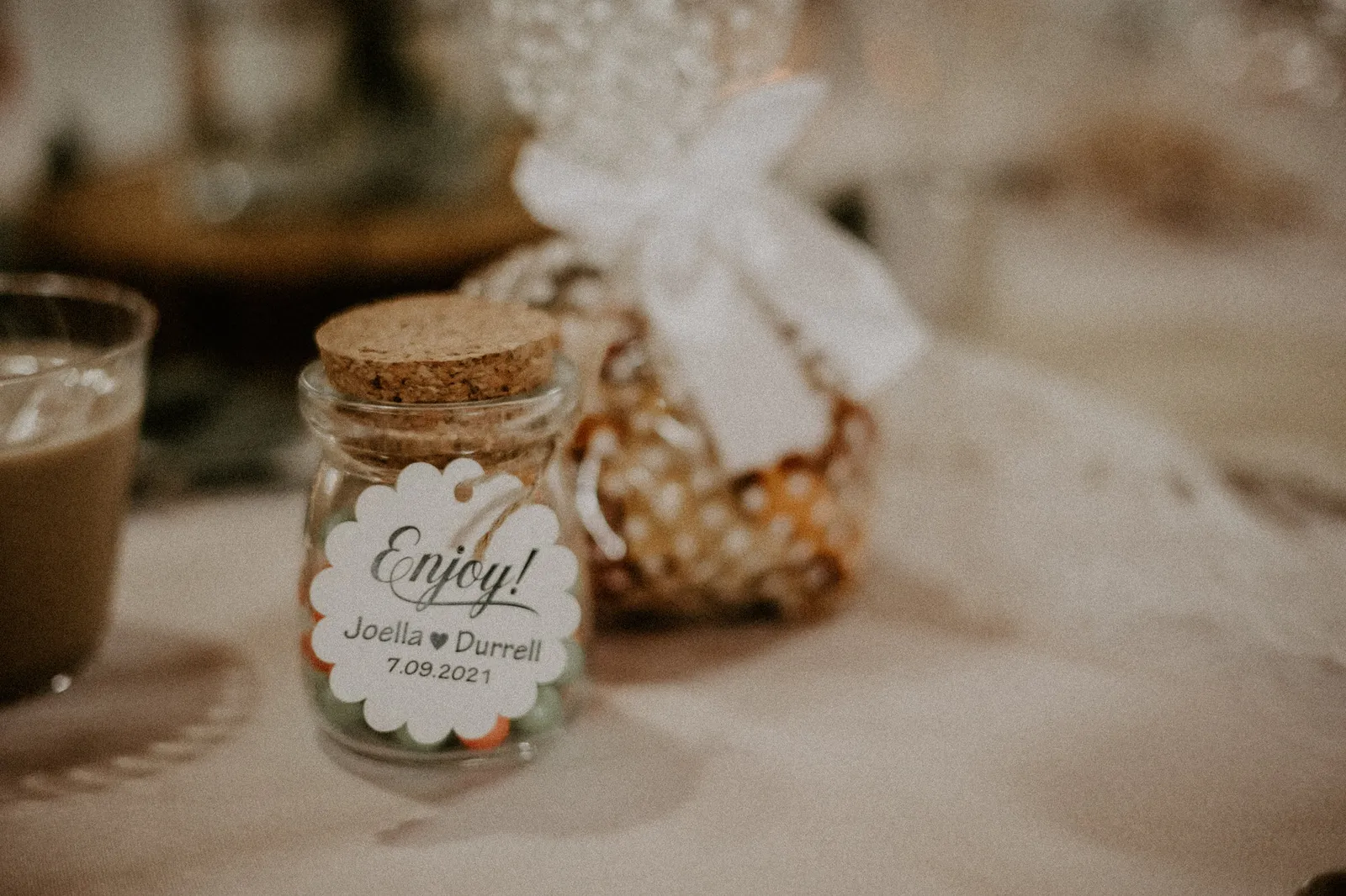 Wedding favour jar with a tag reading Enjoy!