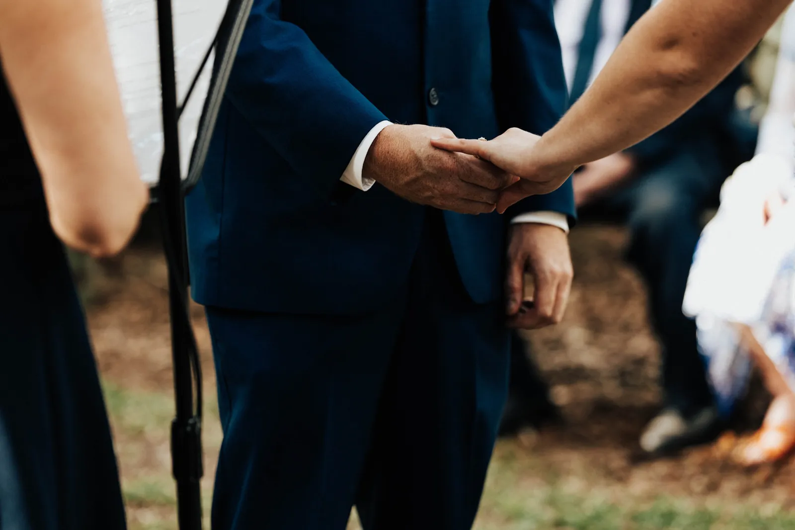 Bride and groom's joined hands during the vows