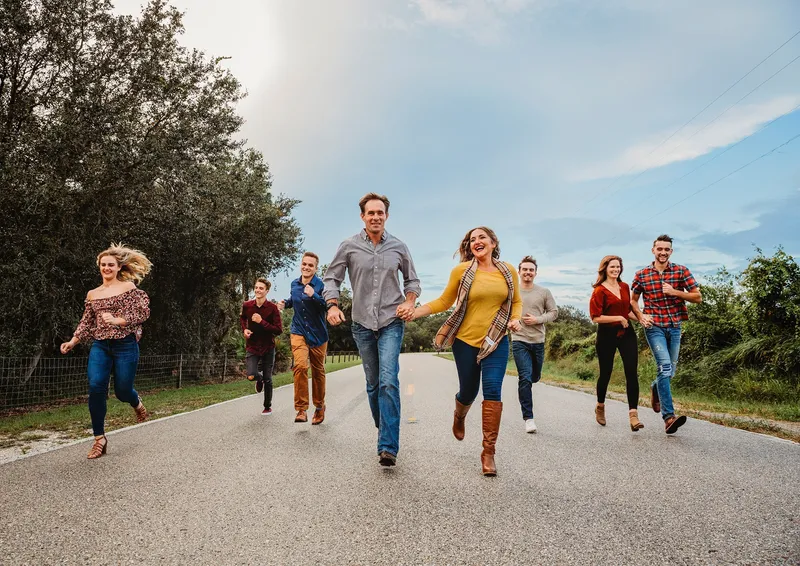 Nikki's family running down a country road together